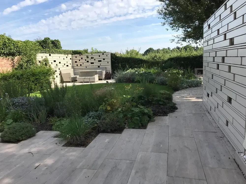 Contemporary garden design in Colchester, Essex with porcelain paving and timber detailing
