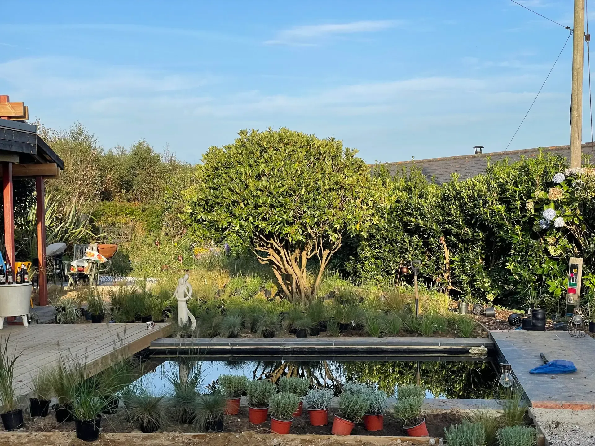 Outdoor kitchen built with recycled tiles and Station Black paving